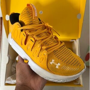 Yellow under Armour basketball shoes